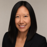 A professional headshot of Miss Gan.