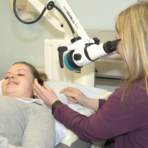 Doctor performing ear examination